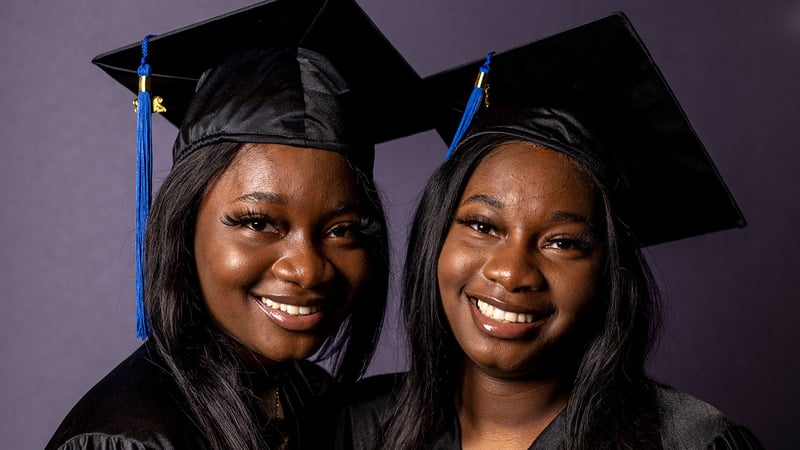 Makiya and Mariah Allen, graduates from LAA smile at graduation