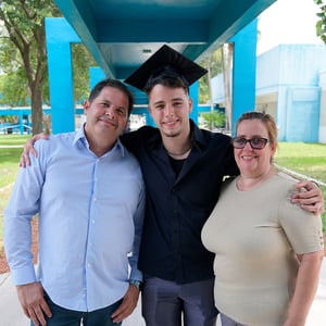 Roberto Hilarion and his parents