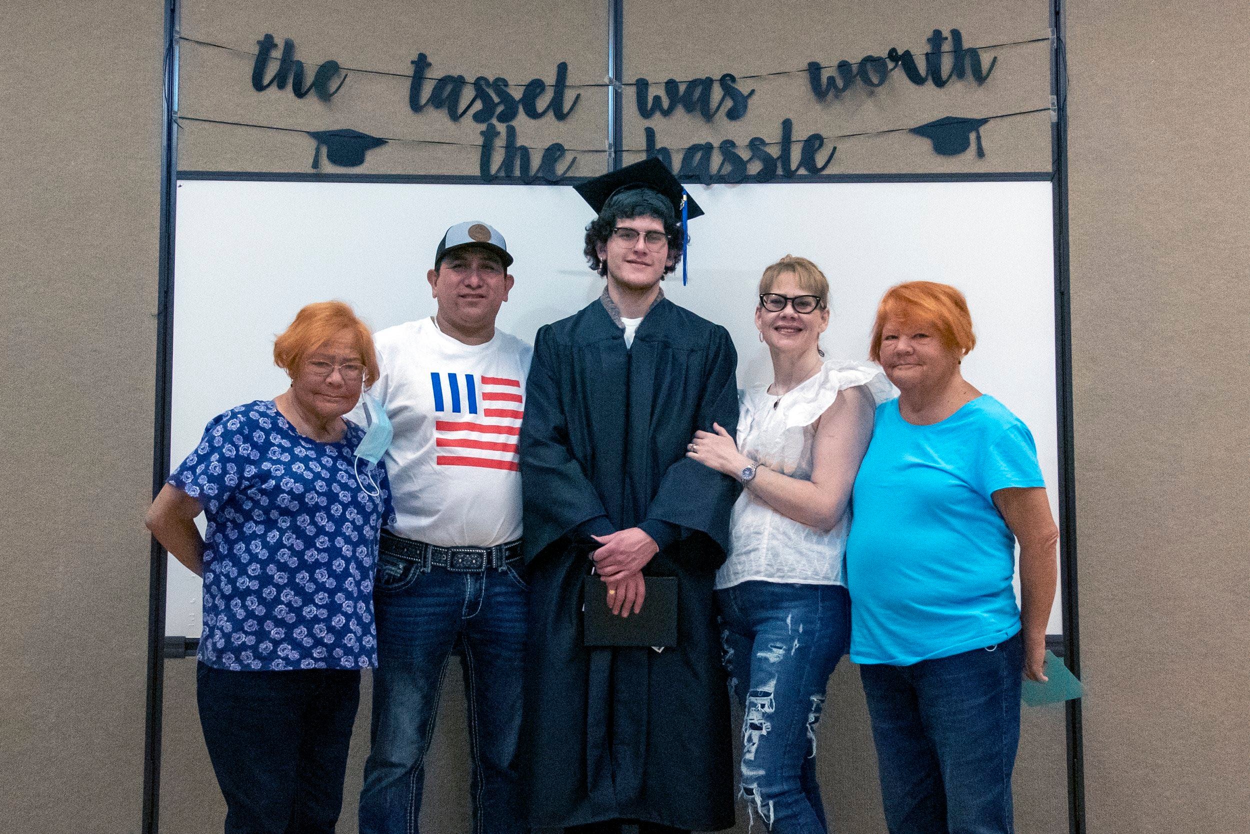 Matteo Orozco in cap and gown with parents